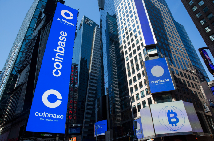 Monitors display Coinbase signage at the Nasdaq MarketSite in New York, U.S.Photographer: Michael Nagle/Bloomberg