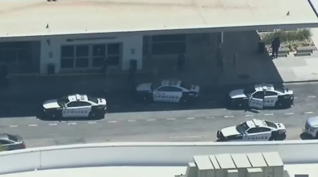 Dallas Police on scene at an active shooting situation at Dallas Love Field Airport. (Credit: KDFW)