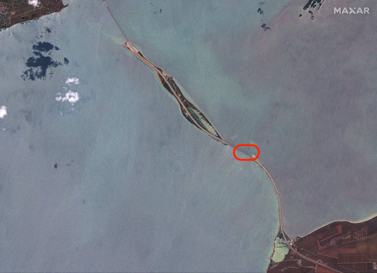 Satellite image showing the Crimea Bridge with the recently damaged section in a red oval. (Satellite photo by Maxar Technologies via AP)