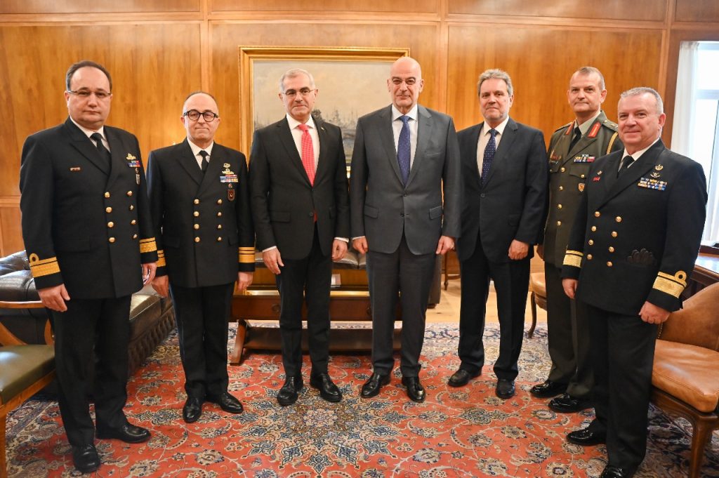 Turkish Deputy-Minister of Foreign Affairs, Burak Akçapar, pictured left of centre and Greek Defense Minister, Nikos Dendias, on the right. 